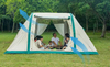 Tent pitched beside the car for camping outdoors