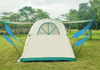 Tent pitched beside the car for camping outdoors