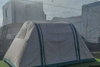 Tent pitched beside the car for camping outdoors
